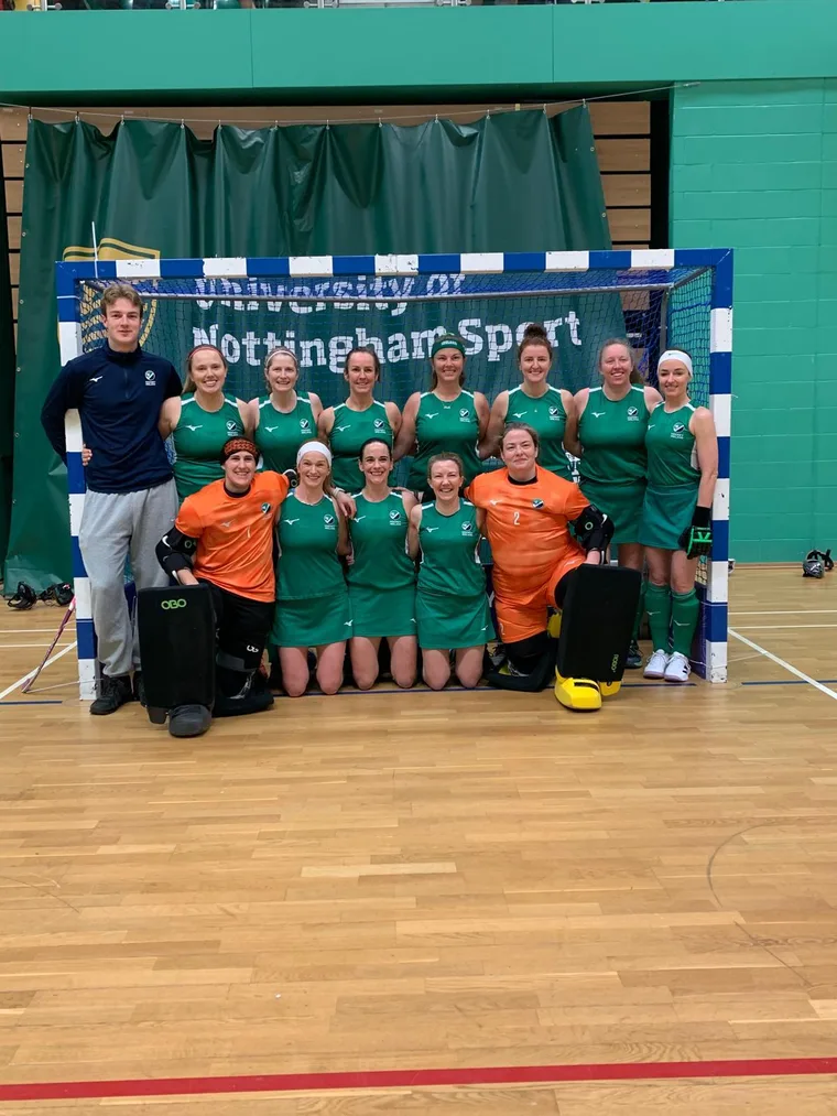 The Ireland O35 women's indoor team in front of the goal.